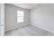 Empty bedroom with carpet flooring and a single window at 228 Maggie Ln, Roxboro, NC 27573