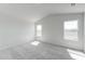 Bright bedroom with vaulted ceilings, plush carpet, and ample natural light at 228 Maggie Ln, Roxboro, NC 27573