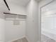 Spacious walk-in closet with built-in shelving and adjacent bathroom access at 228 Maggie Ln, Roxboro, NC 27573