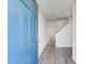Inviting entryway with a bold blue door and view of the staircase at 228 Maggie Ln, Roxboro, NC 27573