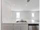 View of the kitchen's double sink, countertops, and open layout at 228 Maggie Ln, Roxboro, NC 27573