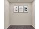 Laundry room with decorative wall art and dark flooring at 228 Maggie Ln, Roxboro, NC 27573