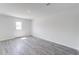 Spacious, bright living room with wood-look flooring and a door to the exterior at 228 Maggie Ln, Roxboro, NC 27573