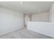 An open loft area with carpet flooring at 228 Maggie Ln, Roxboro, NC 27573