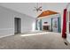 Living room with vaulted ceiling, fireplace, and large windows at 25 Sylvan Way, Zebulon, NC 27597