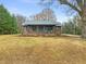 Charming brick home with covered front porch and updated landscaping at 320 W Orange St, Hillsborough, NC 27278