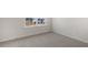 Empty bedroom with neutral carpet and large window at 432 Ashley Run, Sanford, NC 27330