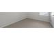 Empty bedroom with neutral carpet and white walls at 432 Ashley Run, Sanford, NC 27330