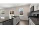 Kitchen island with sink, dishwasher, and stainless steel appliances at 432 Ashley Run, Sanford, NC 27330