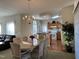 Dining area open to kitchen with chandelier and table with chairs at 50 Sterling Dr, Franklinton, NC 27525