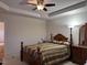 Large main bedroom with tray ceiling, carpeted floors, and ensuite bathroom access at 50 Sterling Dr, Franklinton, NC 27525