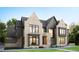 Modern two-story home with mixed siding, large windows, and a two-car garage at 5001 Rampart St, Raleigh, NC 27609