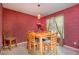 Dining room with wooden table, chairs, and large window at 105 Gentle Rio Ct, Garner, NC 27529