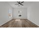 Bright bedroom with wood-look flooring and ceiling fan at 112 Edgewood Dr, Roxboro, NC 27573
