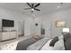 Spacious bedroom with ensuite bathroom and ceiling fan at 112 Edgewood Dr, Roxboro, NC 27573