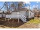 Rear exterior of house with large deck and fenced backyard at 112 Edgewood Dr, Roxboro, NC 27573