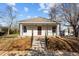 Charming home with a covered front porch, updated siding, and landscaping at 112 Edgewood Dr, Roxboro, NC 27573
