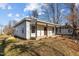 Front exterior of a charming home with covered porch and landscaped yard at 112 Edgewood Dr, Roxboro, NC 27573