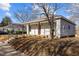 Side view of a charming home with a covered front porch and updated siding at 112 Edgewood Dr, Roxboro, NC 27573