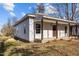 Front view of a house with covered porch, walkway, and yard at 112 Edgewood Dr, Roxboro, NC 27573