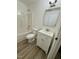 Clean bathroom with white vanity, toilet and tub at 2816 Smoke Pl, Raleigh, NC 27610