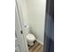 Small, clean bathroom with white toilet and flooring at 2816 Smoke Pl, Raleigh, NC 27610