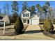Two-story house with a driveway and landscaping at 2816 Smoke Pl, Raleigh, NC 27610