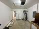 Unfinished garage with water heater and door to house at 2816 Smoke Pl, Raleigh, NC 27610