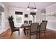 Dining room virtually staged with a table, chairs, and artwork at 4222 Rogers Rd, Durham, NC 27704