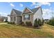 Side view of a two-story home with a brick and siding exterior at 4236 Aviemore, Burlington, NC 27215