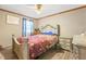 Cozy bedroom with decorative bed frame, matching dresser, and ceiling fan at 160 E Forest Oaks Dr, Sanford, NC 27330