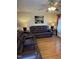 Living room with hardwood floors and leather furniture at 1603 Robinhood Rd, Durham, NC 27701