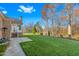 Spacious backyard with lush green lawn and mature trees, a patio, and an outdoor grill at 4109 Cheek Point Pl, Burlington, NC 27215