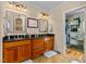 Spacious bathroom featuring dual vanities, granite counters, and a walk-in shower at 4109 Cheek Point Pl, Burlington, NC 27215