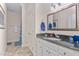 Bathroom includes a vanity with a granite countertop and a shower/tub combo at 4109 Cheek Point Pl, Burlington, NC 27215