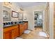 Luxurious bathroom with double vanity, granite countertops, and walk-in shower at 4109 Cheek Point Pl, Burlington, NC 27215