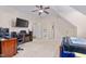 Bedroom with a bed, a desk, a TV, and carpeted flooring at 4109 Cheek Point Pl, Burlington, NC 27215