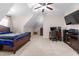 Spacious bedroom featuring a bed, workspace, and entertainment center at 4109 Cheek Point Pl, Burlington, NC 27215