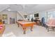 Bonus room with a pool table, entertainment center, and comfortable seating at 4109 Cheek Point Pl, Burlington, NC 27215