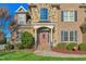 Close-up of the stone and brick exterior, front door, and porch at 4109 Cheek Point Pl, Burlington, NC 27215