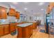 Spacious kitchen with island, stainless steel appliances, and breakfast bar at 4109 Cheek Point Pl, Burlington, NC 27215