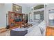 Spacious living room with large windows, plush seating, and a cozy fireplace at 4109 Cheek Point Pl, Burlington, NC 27215