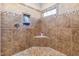 Large walk-in shower with built-in shelves and corner seat at 4109 Cheek Point Pl, Burlington, NC 27215