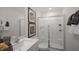 Bright and clean bathroom with walk-in shower, white vanity, and modern fixtures at 447 Belgian Red Way, Wake Forest, NC 27587