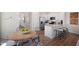 Bright, open kitchen with stainless steel appliances, granite countertops, and an island with bar seating at 447 Belgian Red Way, Wake Forest, NC 27587
