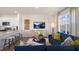 Open-concept living space with kitchen, dining area, and comfortable seating at 447 Belgian Red Way, Wake Forest, NC 27587