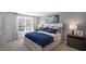 Inviting main bedroom with large window, plush carpeting, and stylishly decorated bed at 447 Belgian Red Way, Wake Forest, NC 27587