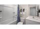 Bright and clean bathroom with shower, white vanity, and decorative shower curtain at 466 Belgian Red Way, Wake Forest, NC 27587