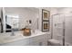 Modern bathroom with double vanity, glass shower enclosure, and contemporary fixtures at 466 Belgian Red Way, Wake Forest, NC 27587