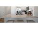 Kitchen island with granite countertop, undermount sink, and seating for three at 466 Belgian Red Way, Wake Forest, NC 27587